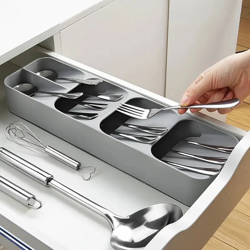 Cutlery tray installed in an open kitchen drawer