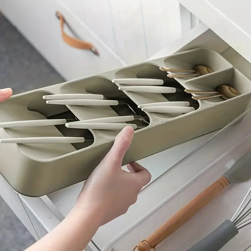 Cutlery tray holding forks, spoons, and knives