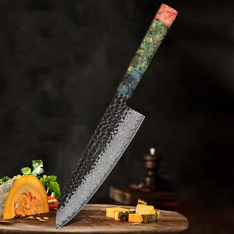 Damascus Steel Chef Knife with handforged blade and resin handle displayed with fresh vegetables.