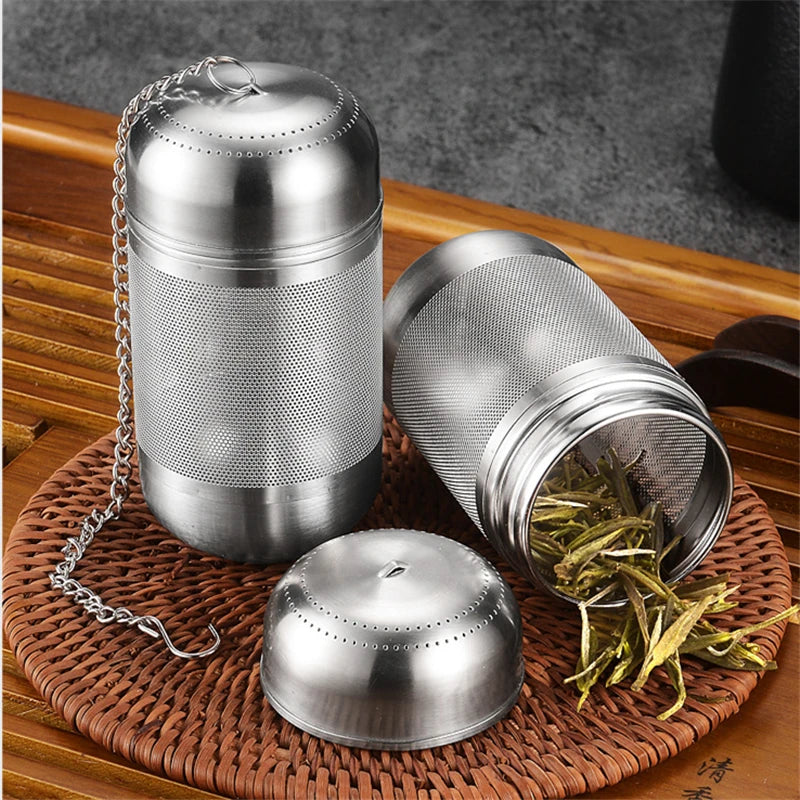 Tea infuser open showing loose tea leaves inside