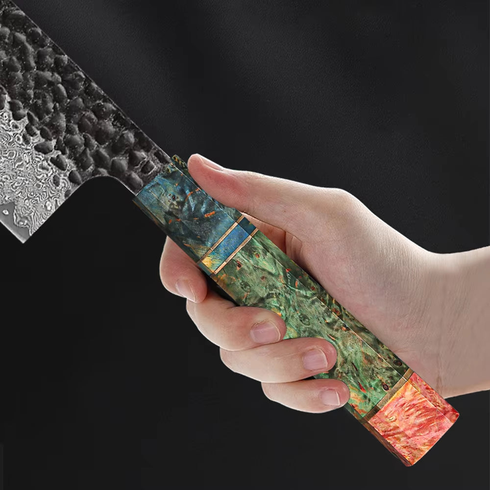 Close-up of Damascus Steel Chef Knife colorful resin handle held in hand showing craftsmanship detail.